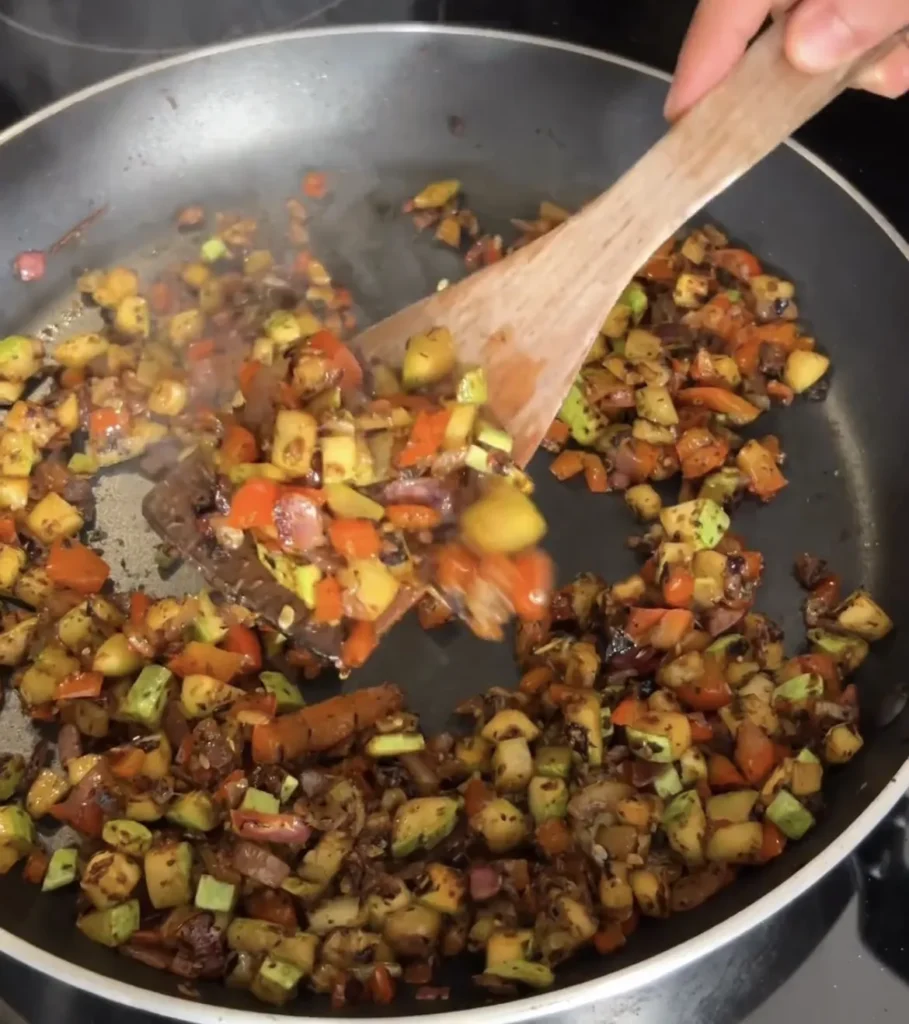 Cooking the filling for the vegan Papusas