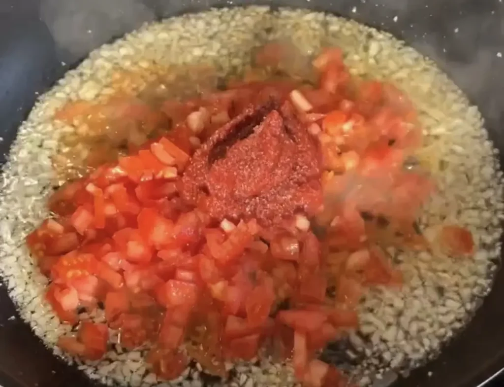 Borani Banjan: Cooking the Eggplant and Tomato Mixture